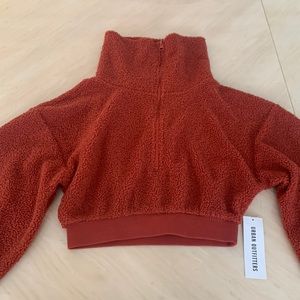 Balloon sleeve, soft, fuzzy crop top with a 3/4 zip